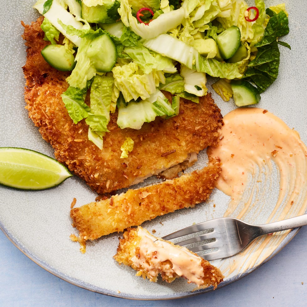 chicken breasts coated in coconut and fried until crispy