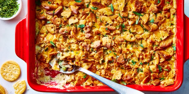 chicken casserole topped with ritz crackers in a red dish