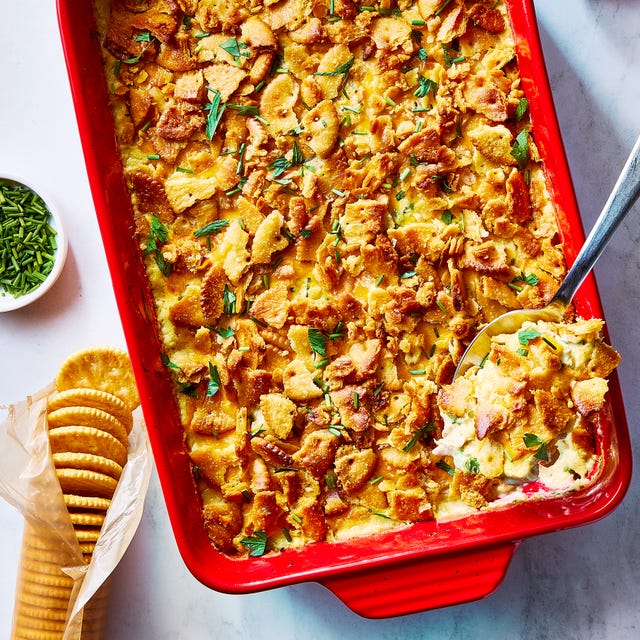 chicken casserole topped with ritz crackers in a red dish