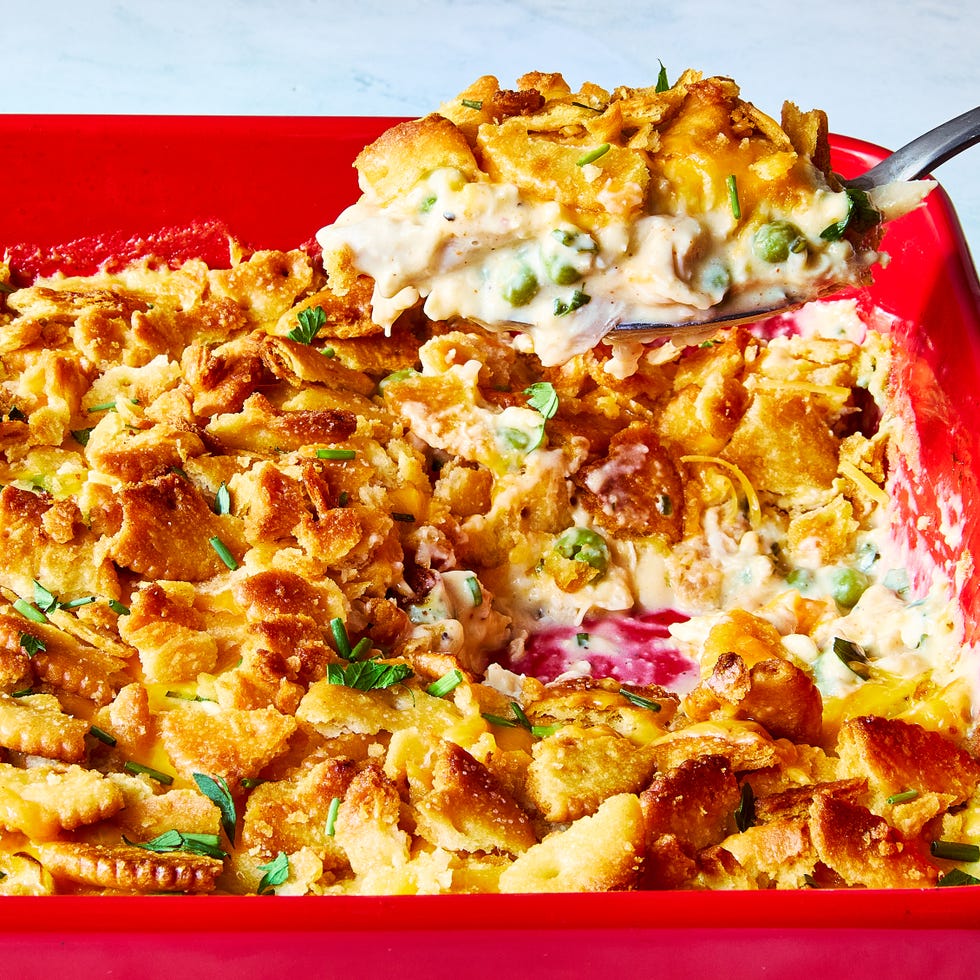 chicken casserole topped with ritz crackers in a red dish