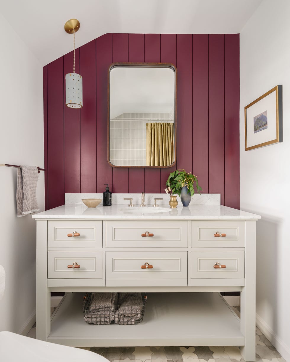 a bathroom with a mirror and sink