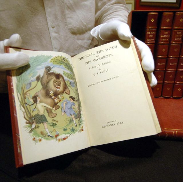 michael p emeny shows a bound set of first edition narnia books by c s lewis at the national fine arts and antiques fair, wednesday january 18, 2006, which expected to sell for 10,000 the fair at the nec, birmingham, will run from the 18th to the 22nd january press association photo photo credit should read david jonespa   photo by david jones   pa imagespa images via getty images