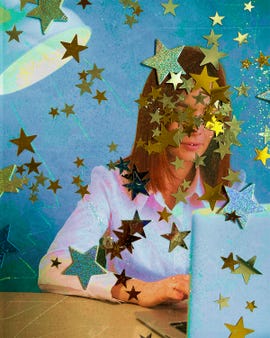 person working on a laptop surrounded by decorative stars