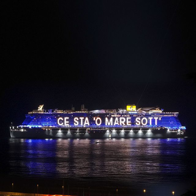 a large ship with lights at night