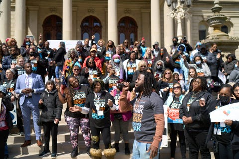 members of crime survivors for safety and justice gathering together for a rally