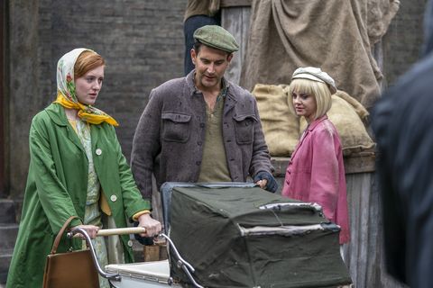 Three people on the street of London's East End as seen in Call The Midwife S9