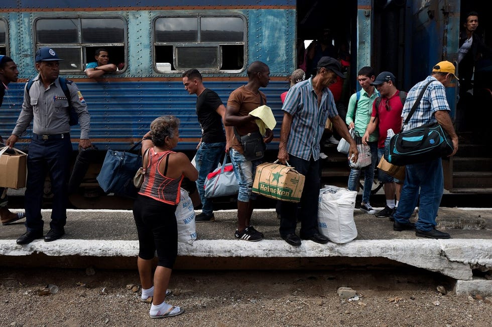 Passengers by train in Cuba