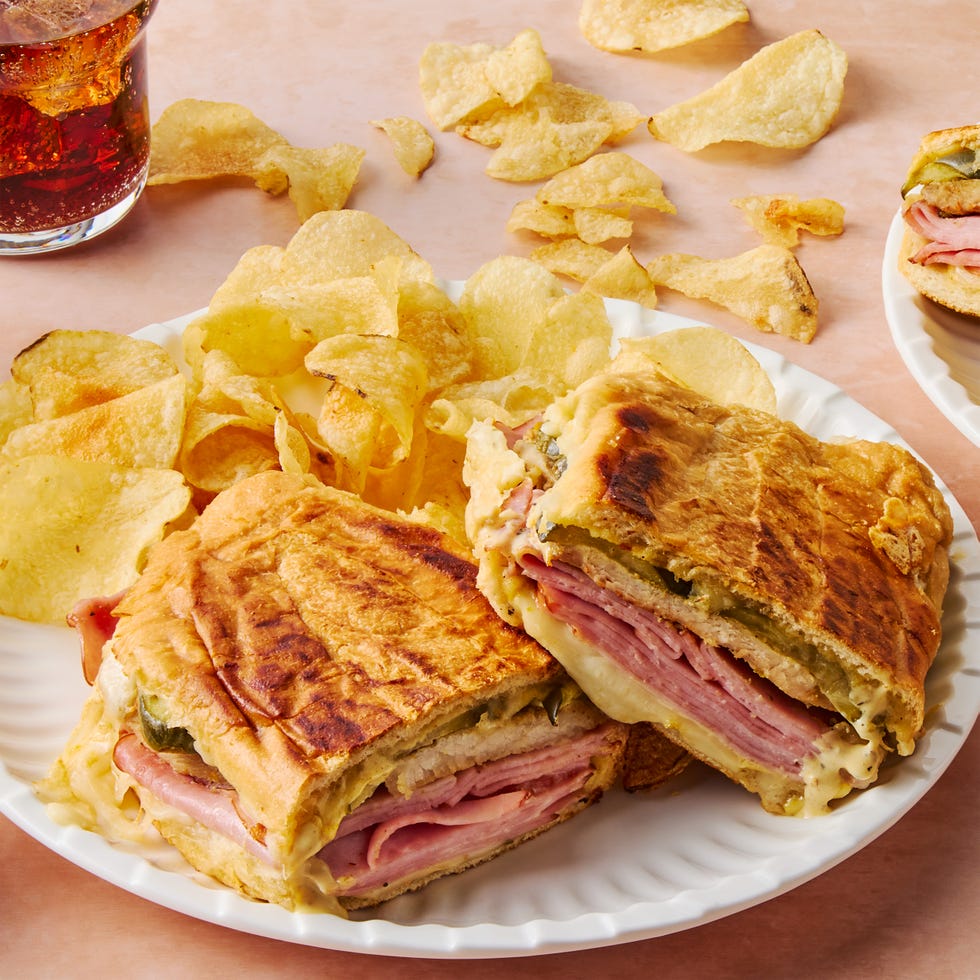 mojo marinated roast pork, thinly sliced deli ham, melty swiss cheese, and tangy dill pickles piled onto a cuban roll and griddled to golden brown perfection