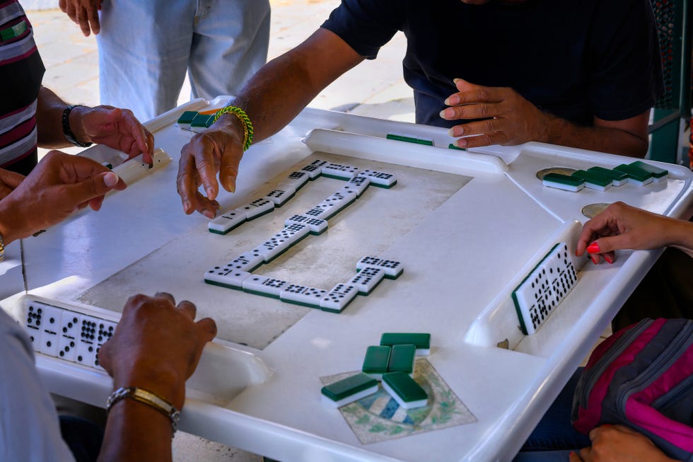 Cubans gather for a game of dominoes at Domino Park (Maximo Gomez Park) on Calle Ocho in Little Havana, Miami