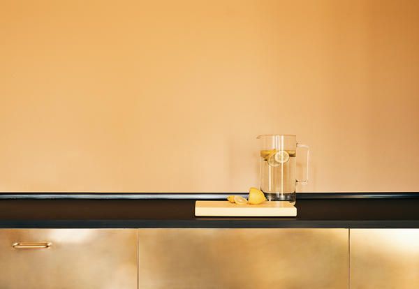 Danish fashion designer Stine Goya appointed brand Reform to upgrade standard IKEA cabinetry into 100% polished brass kitchen