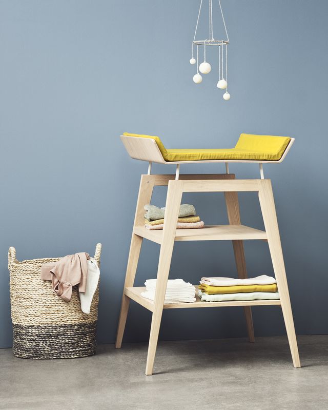 Yellow and wooden changing table
