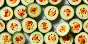 hollowed out cucumber circled filled with veggies and served with spicy mayo