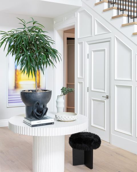 entryway with black stool