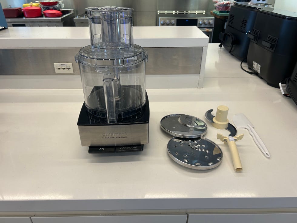 cuisinart food processor on a countertop with components displayed