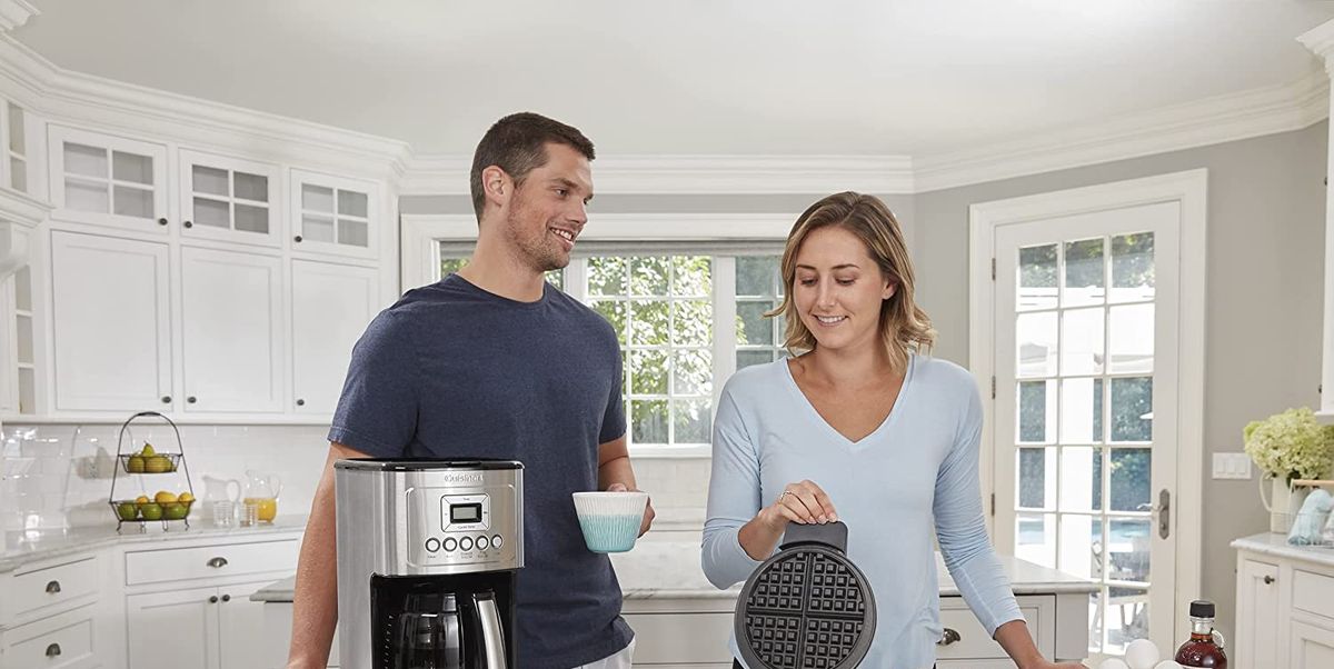 people smiling and getting coffee from the cuisinart coffee maker