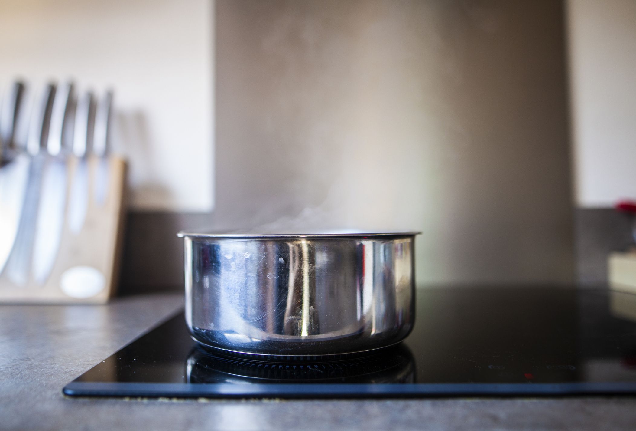 Royalty-Free photo: Boiling water on gray stainless steel cooking pot