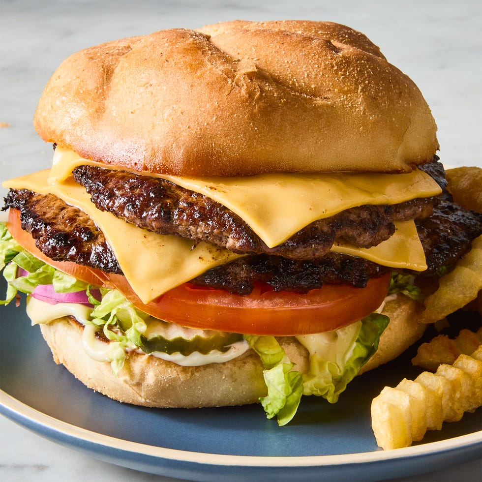 double patty with cheese, lettuce, and tomato on a bun