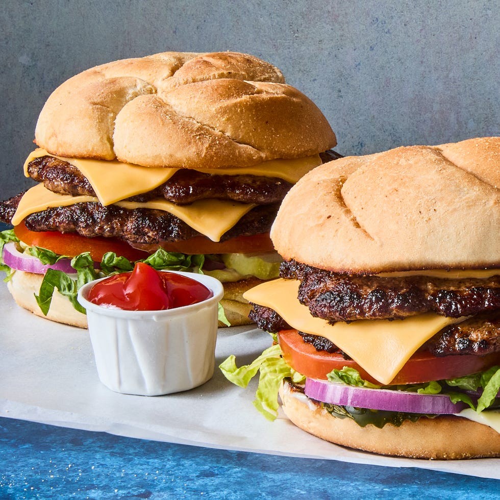 double patty with cheese, lettuce, and tomato on a bun