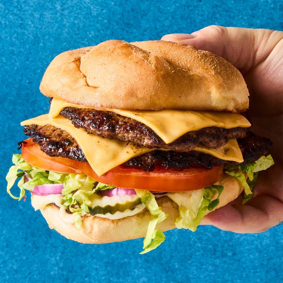 double patty with cheese, lettuce, and tomato on a bun