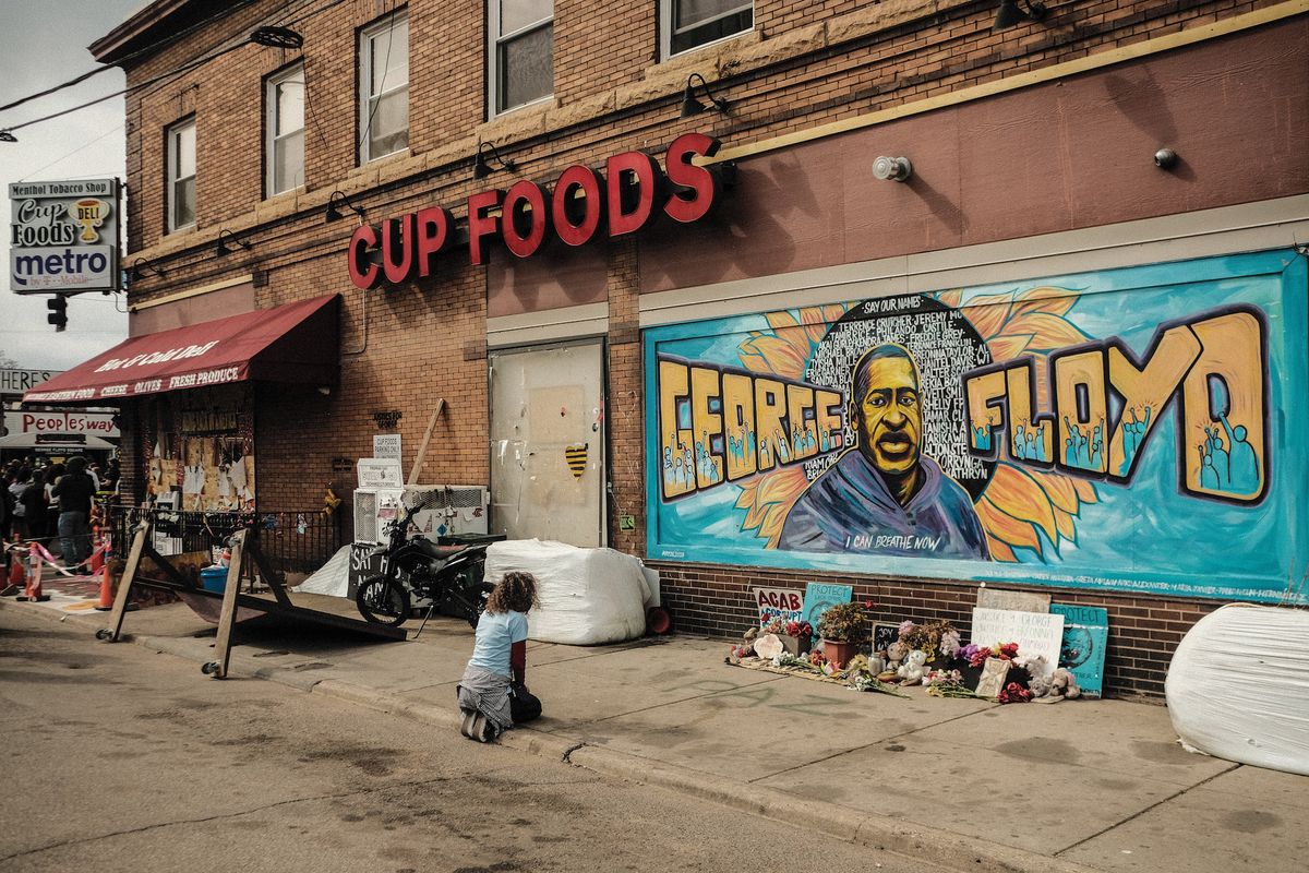 powderhorn park, minneapolis, minnesota, united states   20210418 a woman pays respect to a mural of george floyd by the cup foods where he was killed by minneapolis police officer derek chauvin in minneapolis, minnesotaon the night before closing statements are set to be delivered in the trial of former minneapolis police officer derek chauvin over the killing of george floyd, a crowd congregated at george floyd plaza where relatives of black men killed by police delivered speeches and made statements photo by matthew hatchersopa imageslightrocket via getty images