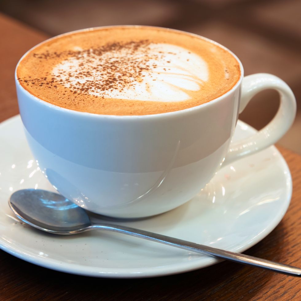 cup of cappuccino. coffee with milk foam and cinnamon powder