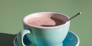 cup of warm chocolate with spoon
