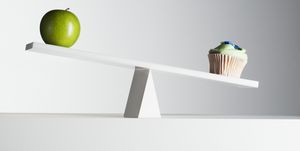 cupcake tipping seesaw with green apple on opposite end