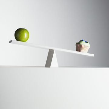 cupcake tipping seesaw with green apple on opposite end