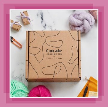 curate craft subscription box on a table surrounded by supplies