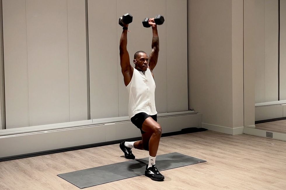 shoulder and arm workout, yusuf jeffers practices curl to press with lunge hold exercise