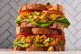 curried chick pea salad sandwich with onions and peppers