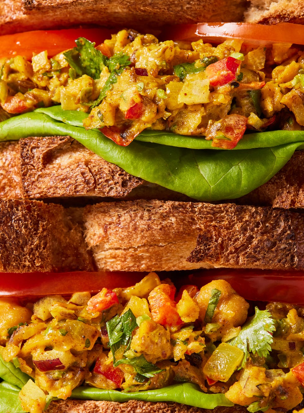 curried chick pea salad sandwich with onions and peppers