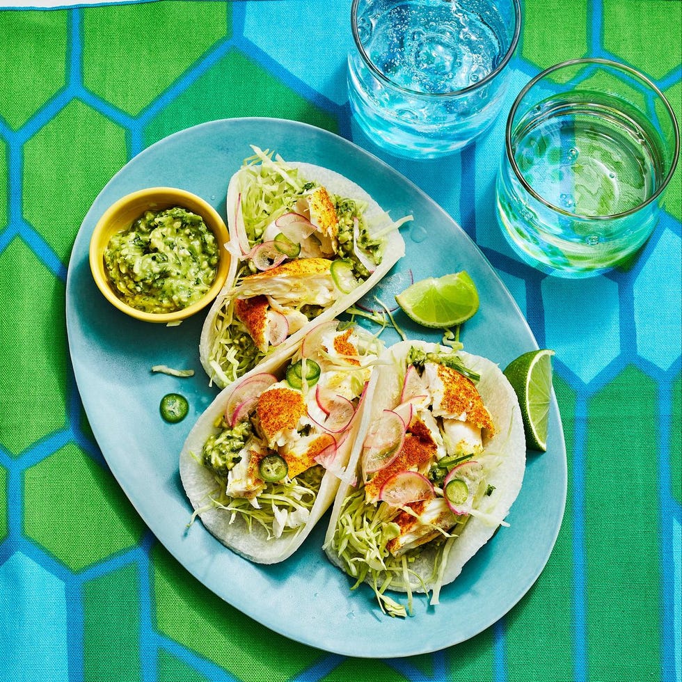 curried fish jicama tacos on a blue plate