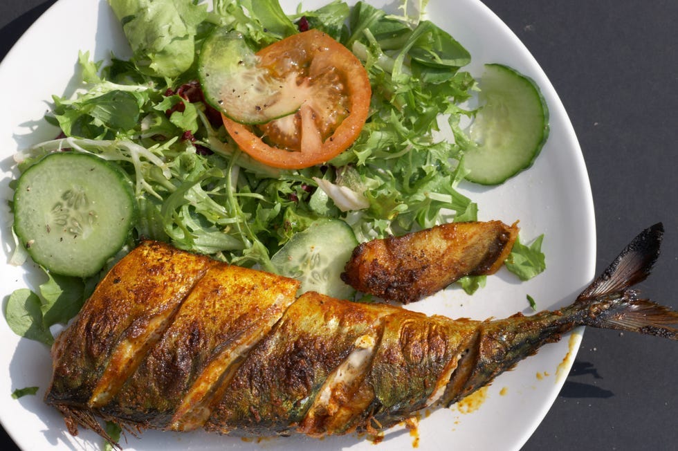 grilled fish served with a fresh salad