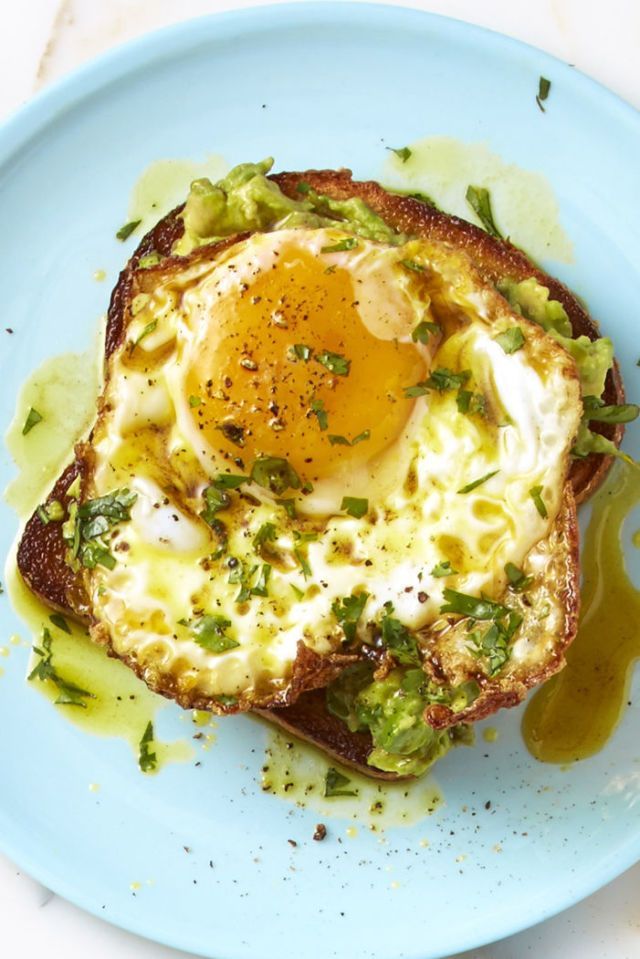 curry avocado egg toast on blue plate