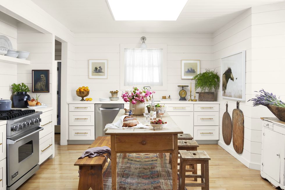 white farmhouse kitchen with shiplap and pine table and benches