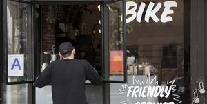 Customer at service window, Nike and Coffee shop, New York, USA