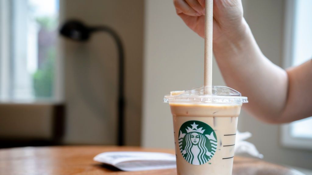 https://hips.hearstapps.com/hmg-prod/images/customer-is-using-a-paper-straw-to-drink-a-cold-starbucks-news-photo-1641497951.jpg?crop=1xw:0.84334xh;center,top