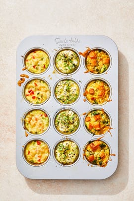 egg muffins with a variety of toppings in a tin