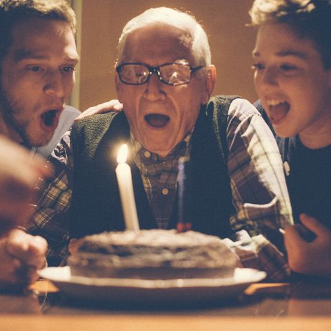 Young men celebrating their grandfathers birthday