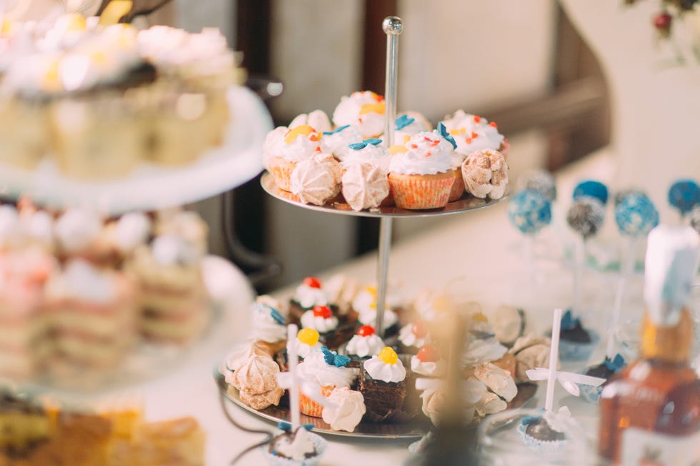 Cute cupcakes on tier at wedding reception