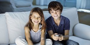 Cute kids watching television