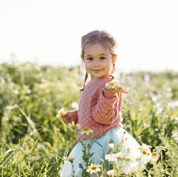 cute little girl having fun time in the nature