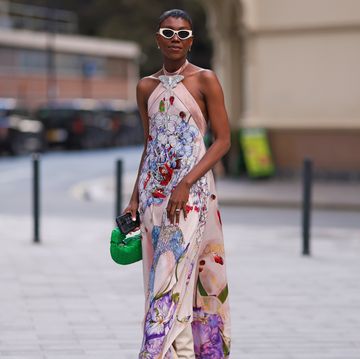 a person wearing a colorful dress and sunglasses spring date dress