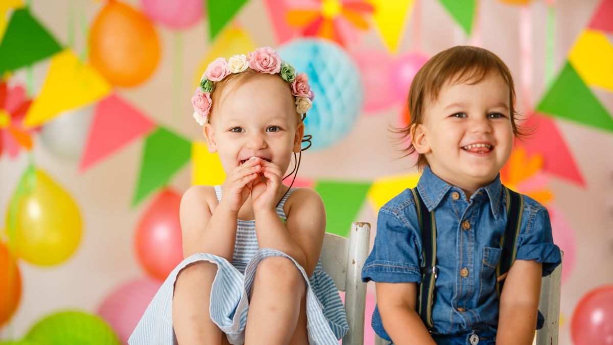 cute toddler twins at birthday party