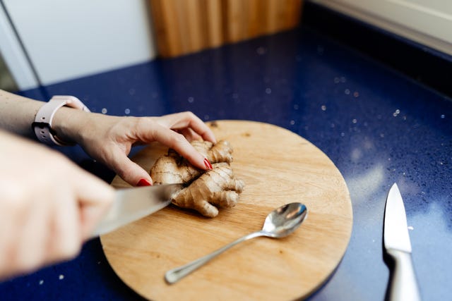 cutting fresh ginger root
