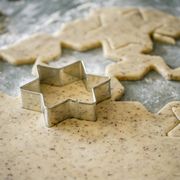 Cutting out star shaped Christmas cookies