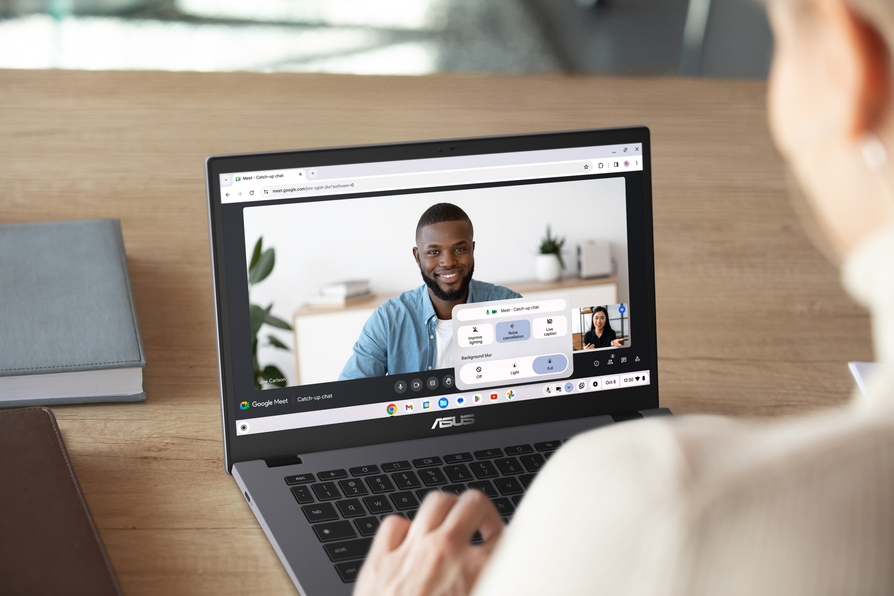 video conference call on a laptop screen with multiple participants
