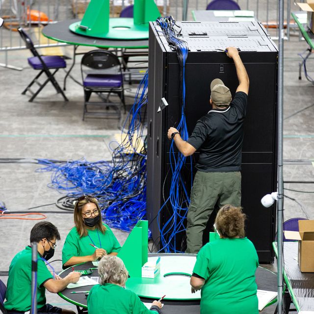 phoenix, az   may 03 contractors working for cyber ninjas, who was hired by the arizona state senate, examine and recount ballots from the 2020 general election on may 3, 2021 in phoenix, arizona photo by courtney pedroza for the washington post