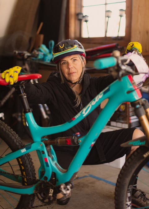 mia phillips next to bike in garage